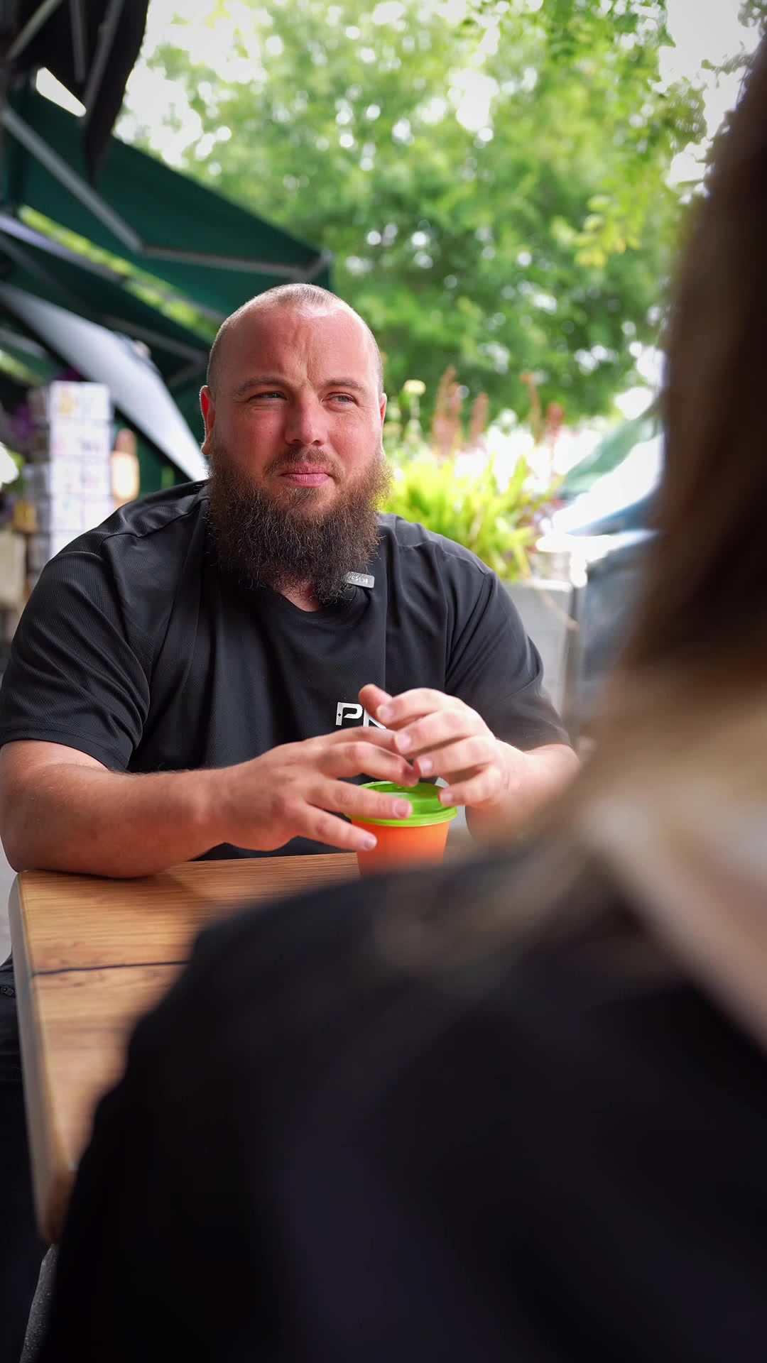 Chris Loverseed in conversation at an outdoor café